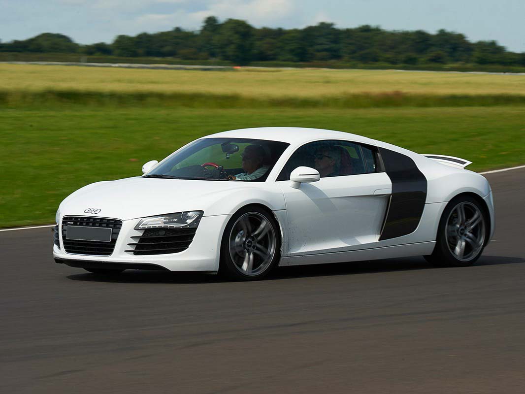 The Audi R8[2] is a mid-engine, 2-seater sports car,[2][3] which uses Audi's trademark quattro permanent all-wheel drive system.[2][4] It was introduced by the German car manufacturer Audi AG in 2006.The car is exclusively designed, developed, and manufactured by Audi AG's private subsidiary company manufacturing high performance automotive parts, Audi Sport GmbH (formerly quattro GmbH),[5] and is based on the Lamborghini Gallardo and presently the Lamborghini Huracán platform.[6] The fundamental construction of the R8 is based on the Audi Space Frame,[2] and uses an aluminium monocoque which is built using space frameprinciples. The car is built by Audi Sport GmbH in a newly renovated factory at Audi's 'aluminium site' at Neckarsulmin Germany.[2]https://en.wikipedia.org/wiki/Audi_R8